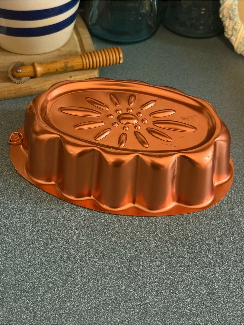 Vintage copper-colored aluminum daisy pattern mold